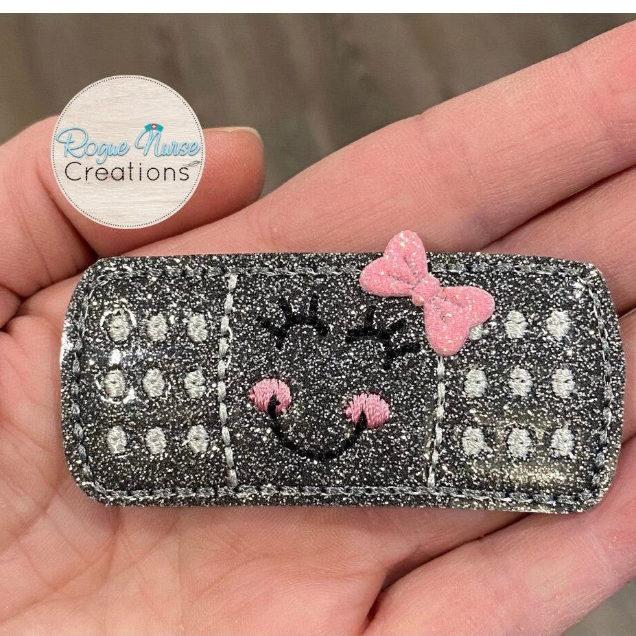 Gun Metal Gray, Glitter Shiny Bandaid With Your Choice of Bow Color, attached to a retractable badge reel. Nurse Name Badge