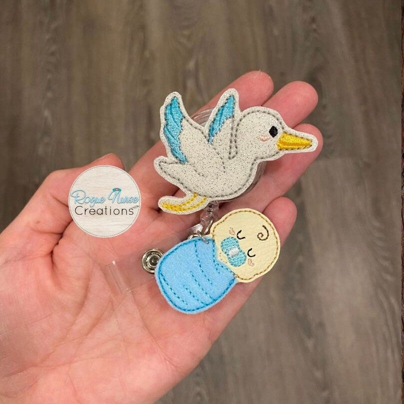 White Glitter Stork Carrying a Swaddled Infant Embroidered Retractable Badge Reel, Baby Nurse Badge Buddy, Swaddled Baby Boy