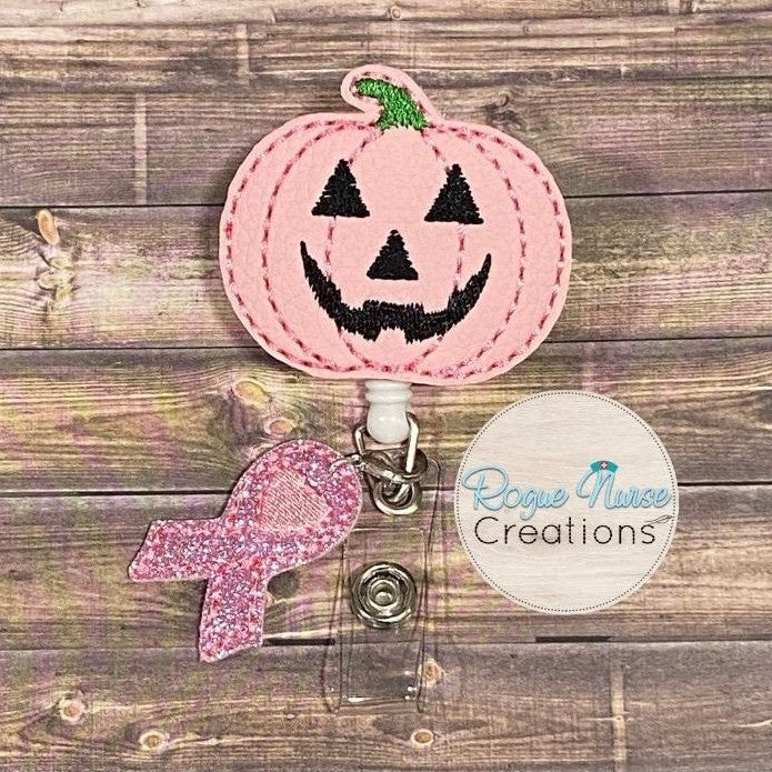 Matte Pink Pumpkin Retractable Badge Reel with a Pink Glitter Awareness Ribbon Dangle. Breast Cancer Awareness Badge Reel