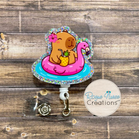 Capybara in a Pink Flamingo Floaty with a pineapple and a cute flower Retractable Badge Reel, UV Printed on Silver Glitter Acrylic