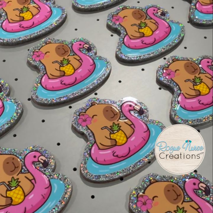Capybara in a Pink Flamingo Floaty with a pineapple and a cute flower Retractable Badge Reel, UV Printed on Silver Glitter Acrylic