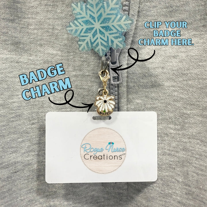 The WILTED Daisy Enamel Badge Charm For The Ordinary Nurse! BLACK Center With White Petals. WILTED Banner below design.