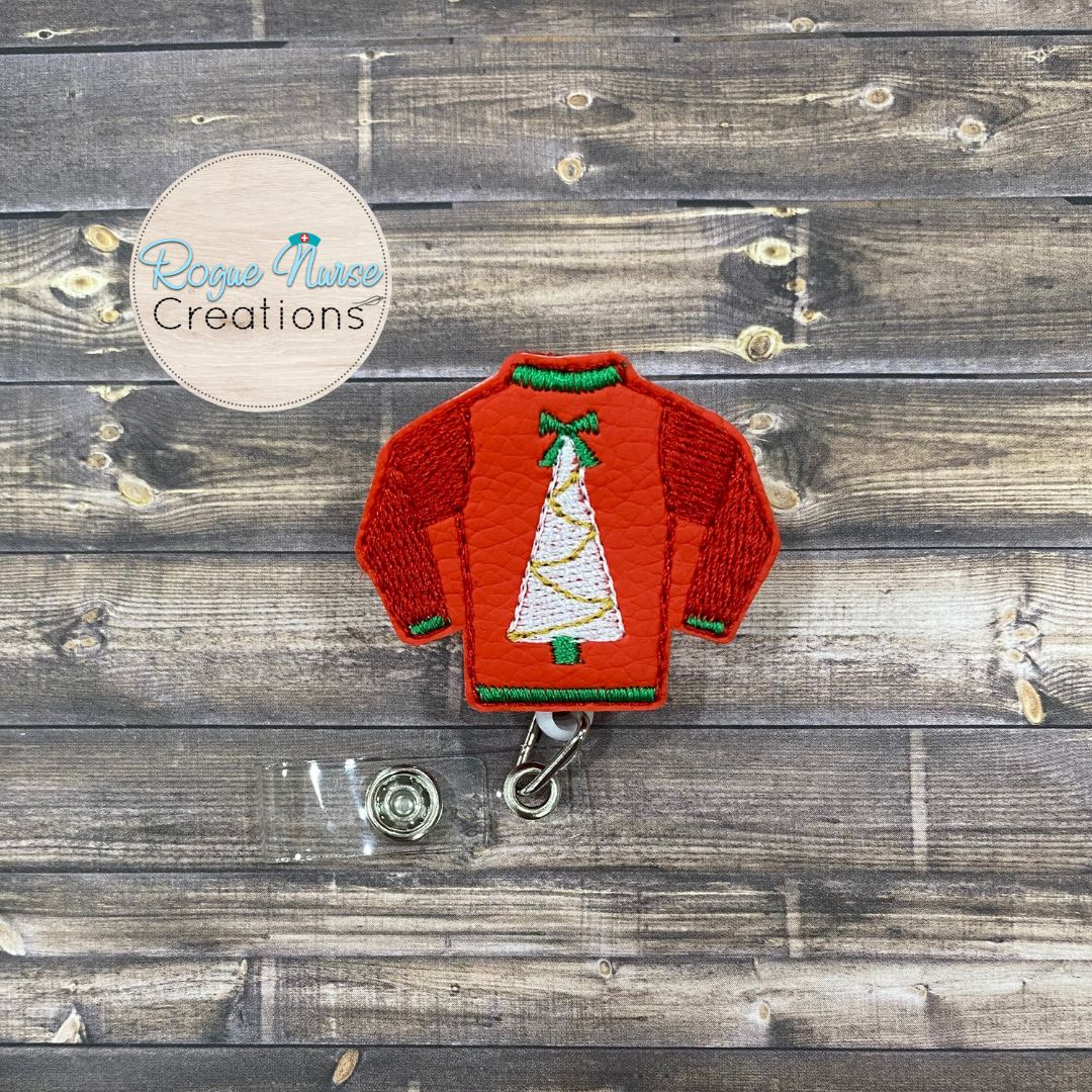 Holiday Sweater Retractable Badge Reel, Matte Red, Glitter Green or Glitter Gold Sweater with a White Holiday Tree and Textured Sleeves.