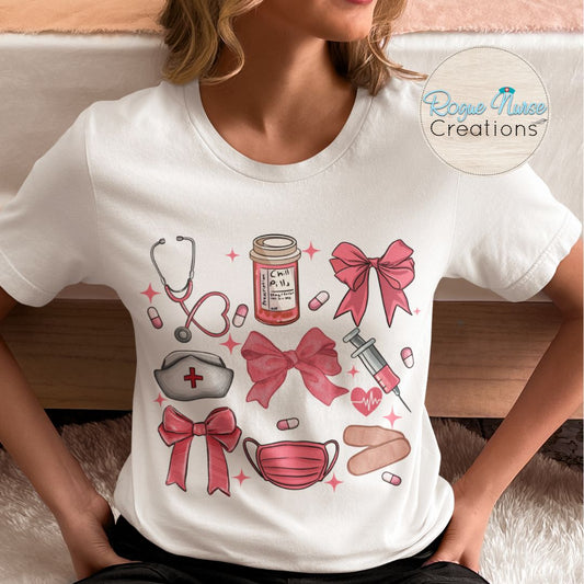 Nurse Graphic T-Shirt, Pink Tones with Bows, Stethoscope, Bandaids, Med Bottle, Mask and Syringe. Cute Healthcare Graphic TShirt, Nurse Gift