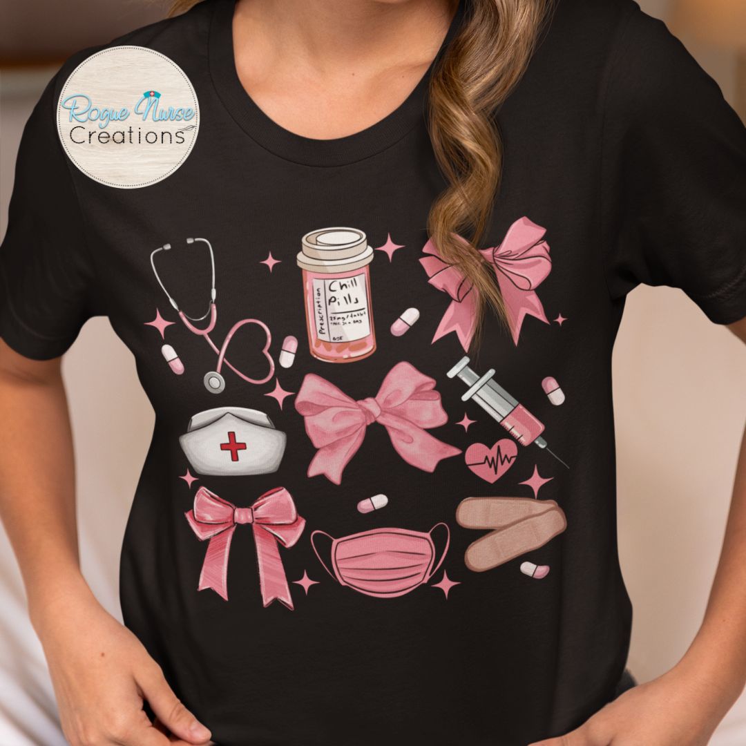 Nurse Graphic T-Shirt, Pink Tones with Bows, Stethoscope, Bandaids, Med Bottle, Mask and Syringe. Cute Healthcare Graphic TShirt, Nurse Gift